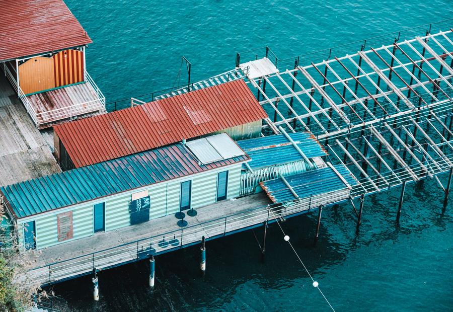 Cradle boat lift raising a runabout in a covered Lake Norman dock well