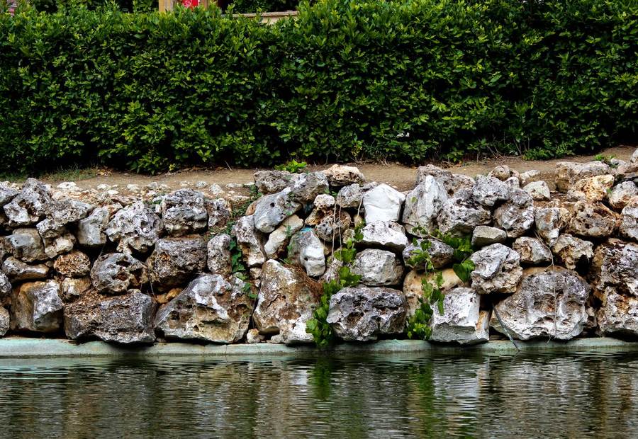 Riprap rock shoreline stabilizing an eroding red-clay bank on Lake Norman